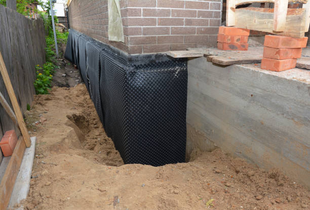 Happy homeowners after waterproofing job in Morris